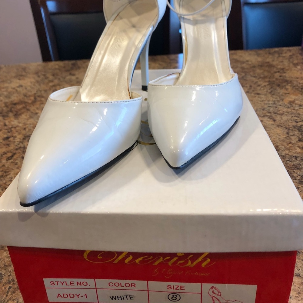 White ankle strap heels.